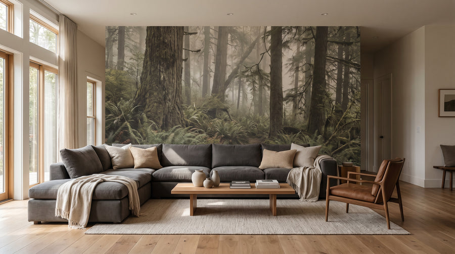 Living room with a large, made-to-measure green forest wall mural behind a modern sofa, showcasing a 2027 wallpaper trend.