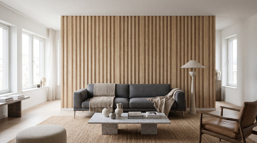 A living room with a comfortable grey sofa set against a feature wall with a realistic wood slat wallpaper mural.